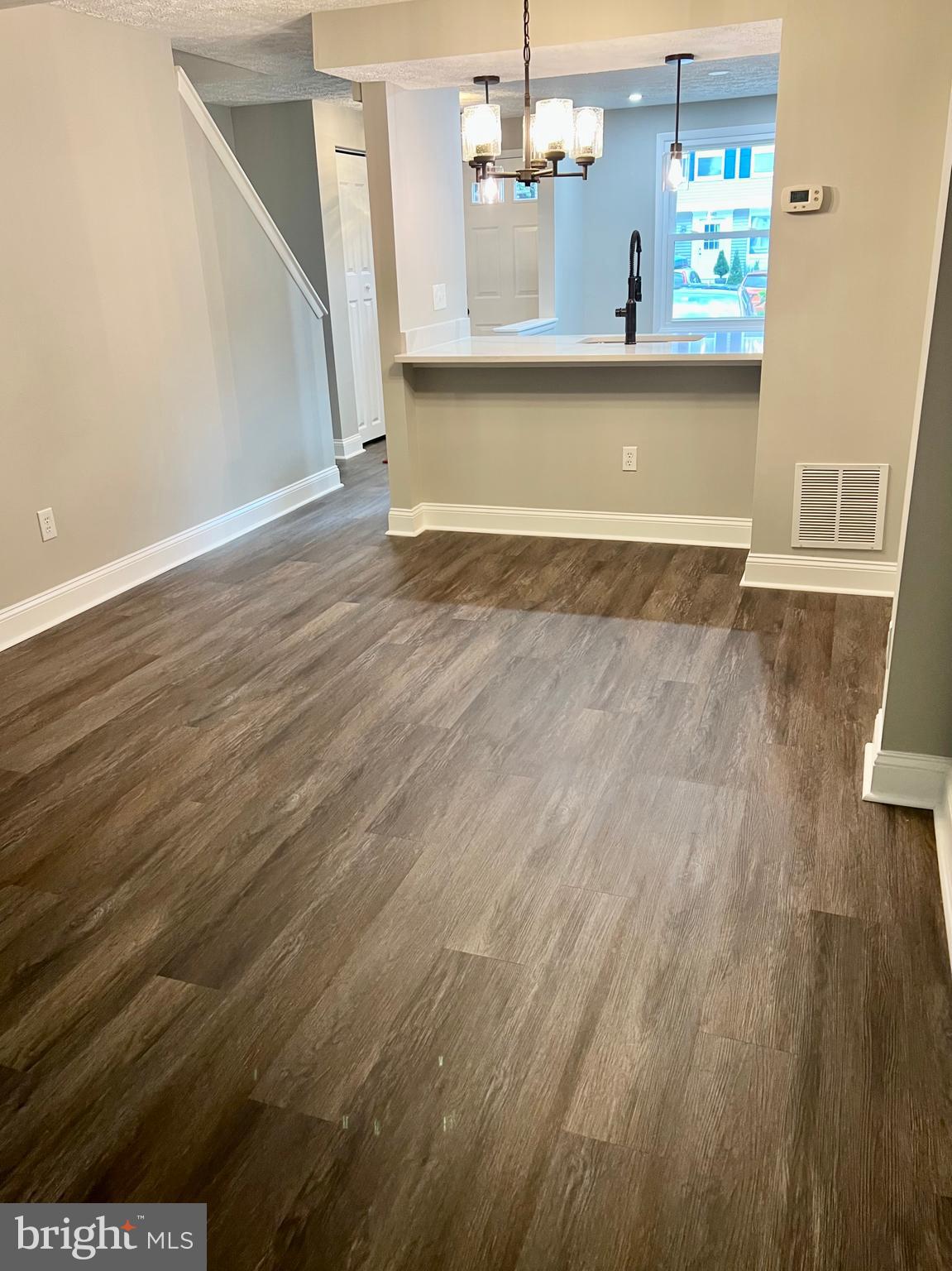 8442 Sugar Creek Lane Springfield, VA 22153 - Photo 8 of 39 a view of a room with wooden floor