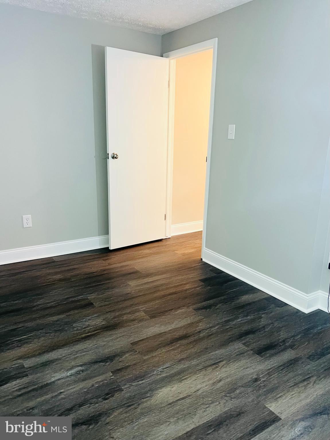8442 Sugar Creek Lane Springfield, VA 22153 - Photo 10 of 39 a view of an empty room with wooden floor