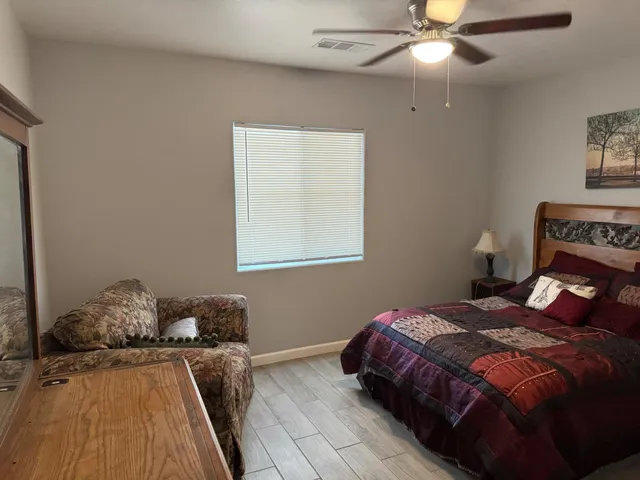 a bedroom with a bed and window