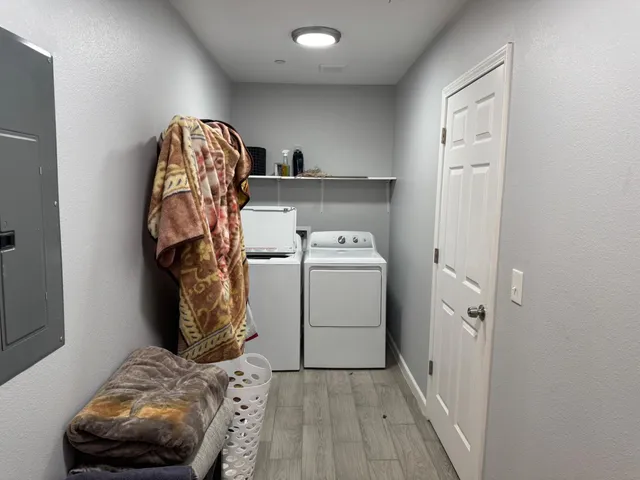 a bedroom with a bed and a utility room