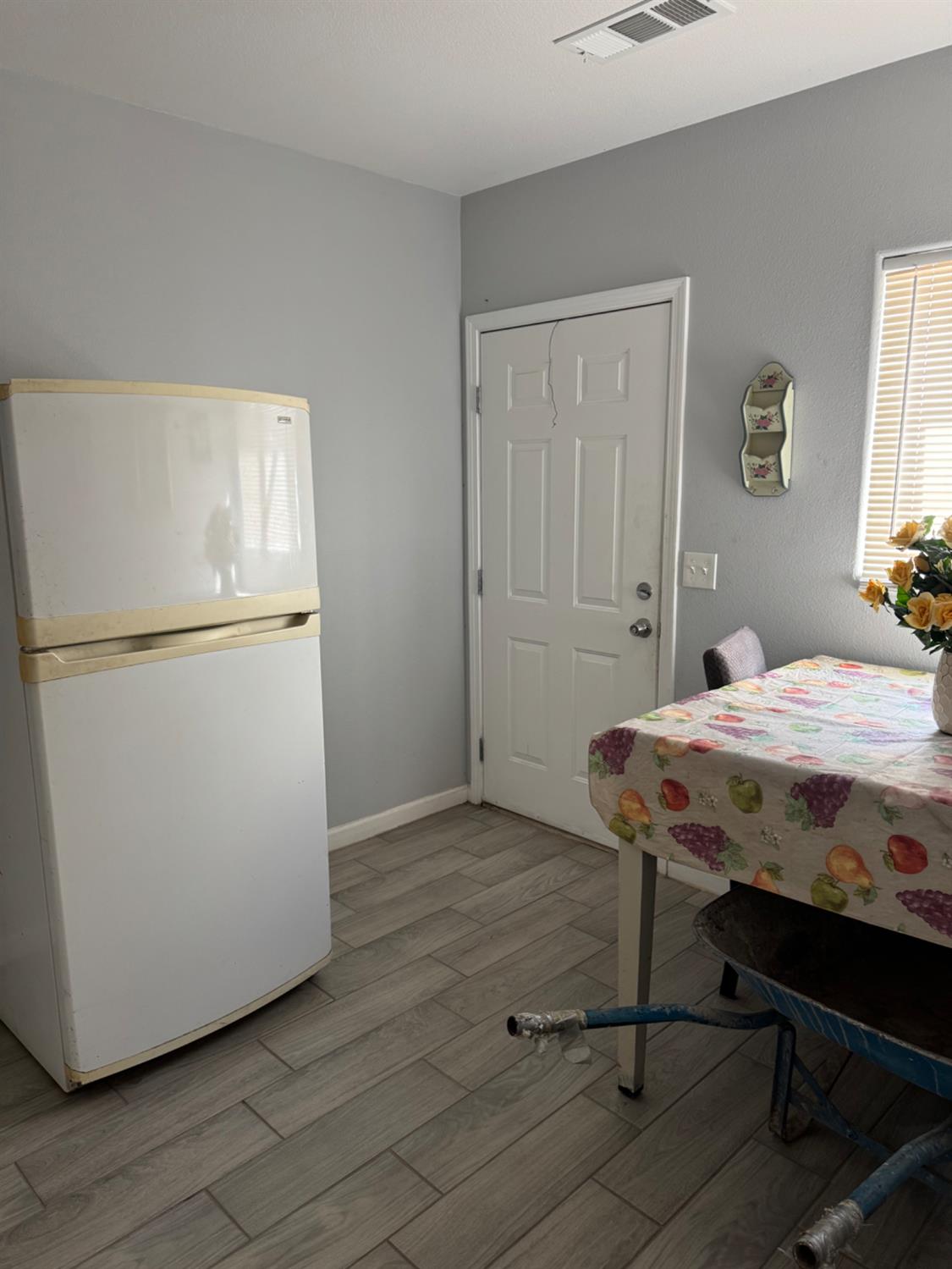 3280 McCall Avenue Selma, CA 93662 - Photo 16 of 56 a bed sitting in a bedroom next to a window