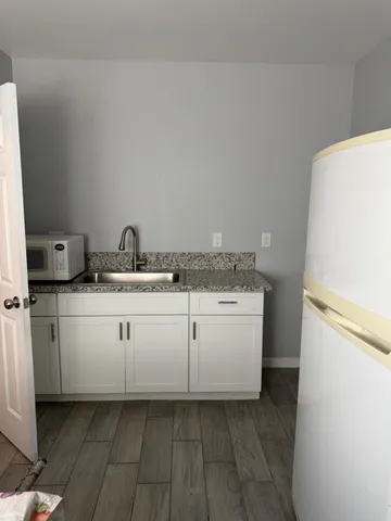 a utility room with a sink a washer and dryer