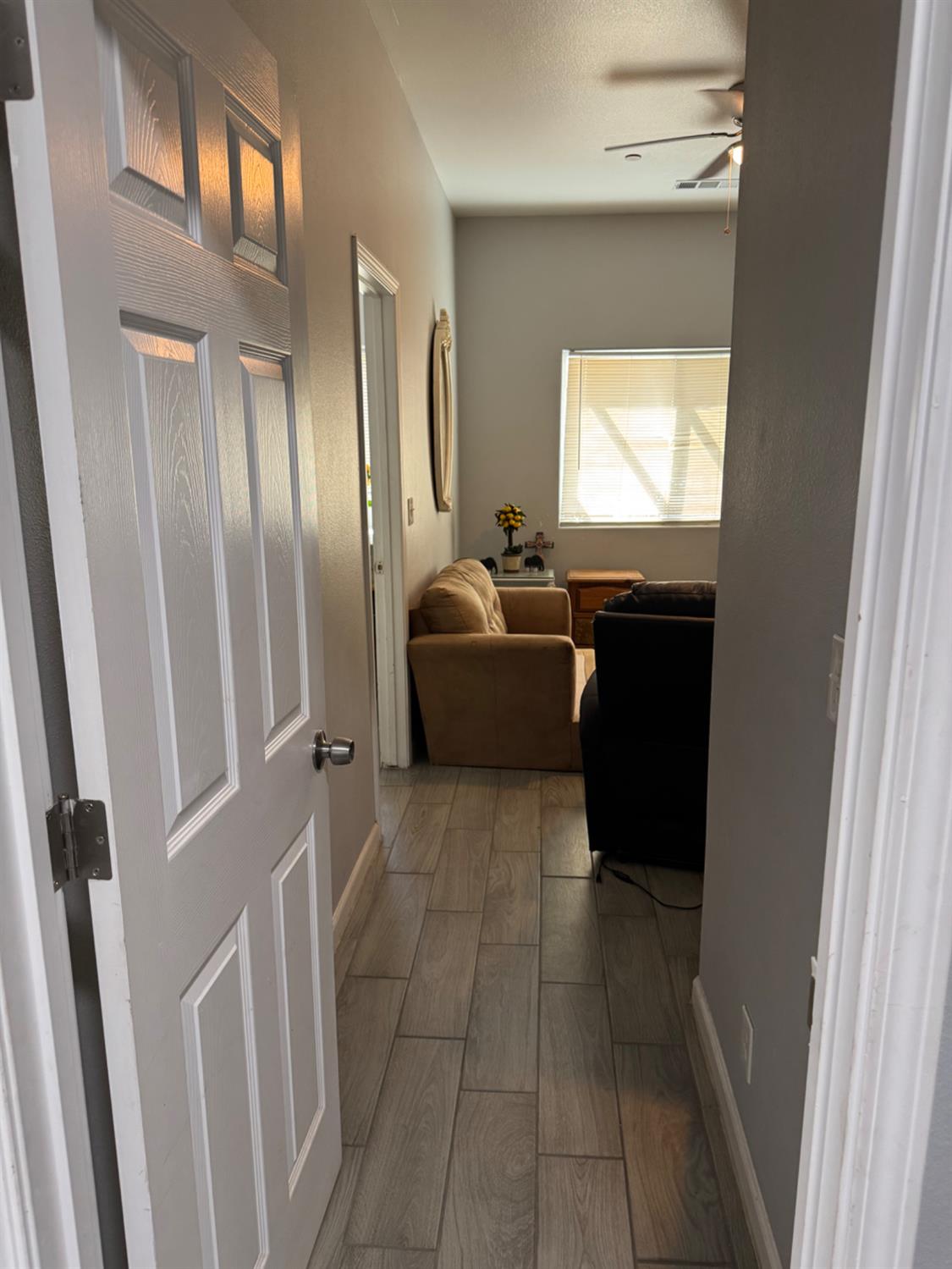 3280 McCall Avenue Selma, CA 93662 - Photo 20 of 56 a living room with a couch and a dresser next to a window