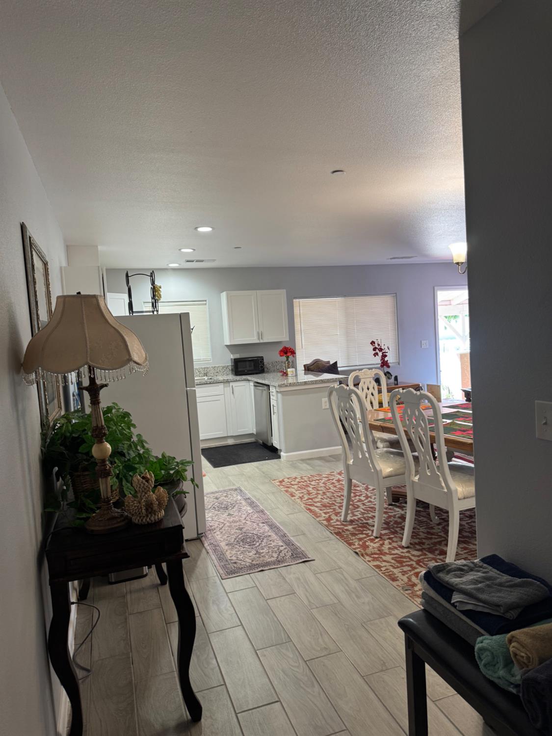 3280 McCall Avenue Selma, CA 93662 - Photo 22 of 56 a living room with furniture and a kitchen area
