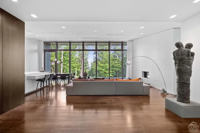 a room with a sink a desk and chair with wooden floor