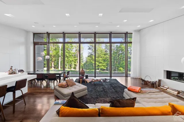 a view of living room with furniture and wooden floor