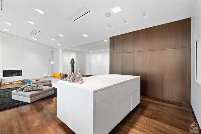 a white bath tub sitting in a bathroom next to a window