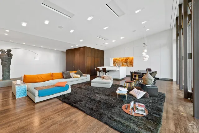 a spacious bedroom with a bed and a large window