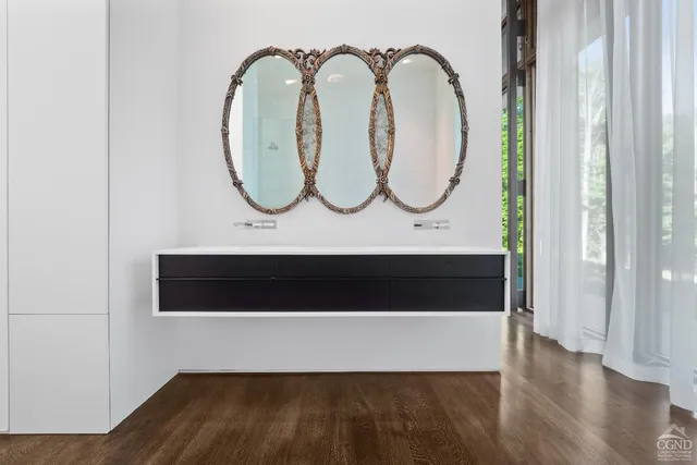 a en suite bathroom with a sink and mirror