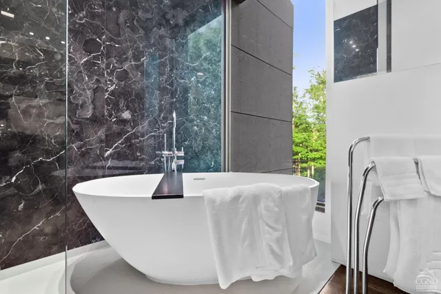 a view of a patio with table and chairs and potted plants
