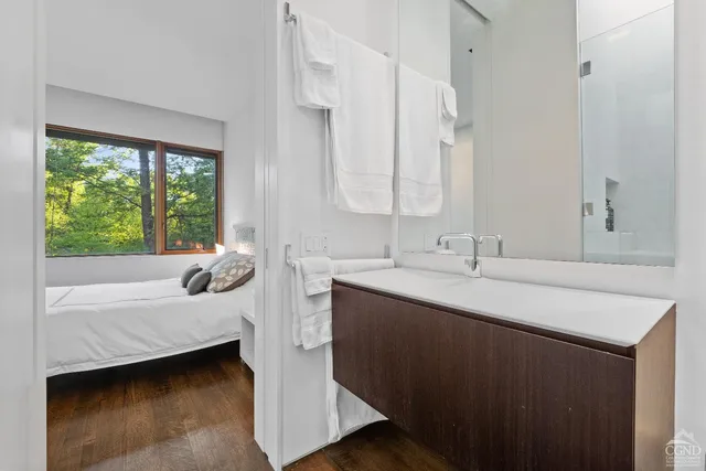 a view of a backyard with plants and a fence