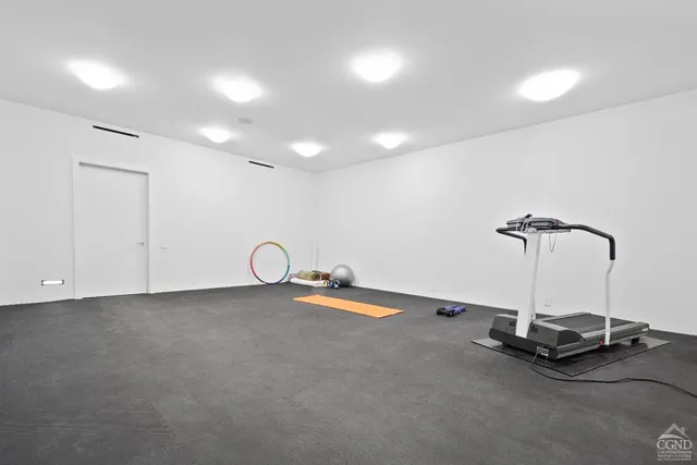 a view of a house with a tree back yard