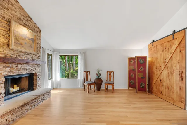 a kitchen with stainless steel appliances granite countertop a refrigerator a microwave and cabinets