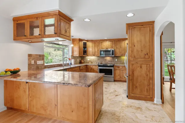 a living room with furniture fireplace and flat screen tv
