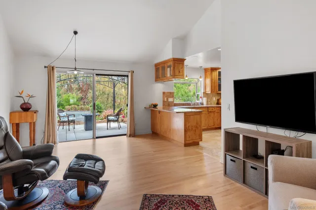 a spacious bathroom with a granite countertop sink and a mirror