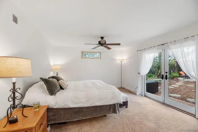 a view of a dining room with clothes and shoes