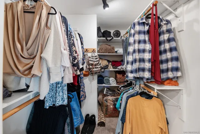 a backyard of a house with lots of green space and outdoor seating