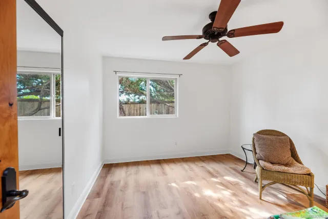 a view of a patio with a table chairs and a yard