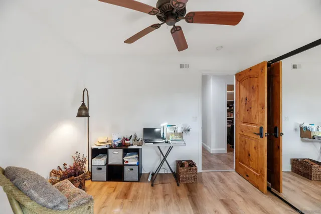 a backyard of a house with lots of green space and a lake view