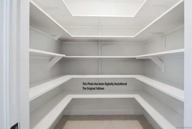 an aerial view of a house with yard table and chairs