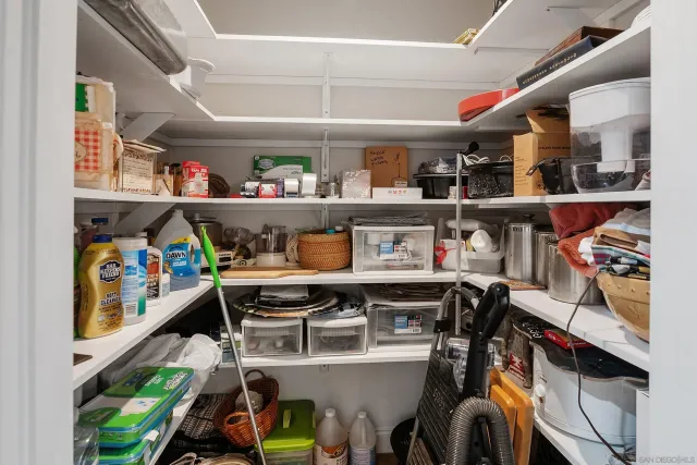 aerial view of a house with table and chairs under an umbrella