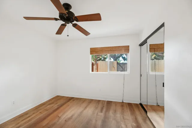 an aerial view of a house with a yard and lake view