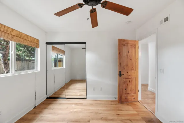 an aerial view of a house with a yard and garden