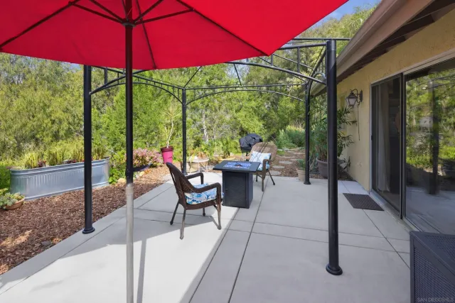 a spacious bathroom with a granite countertop sink and a mirror