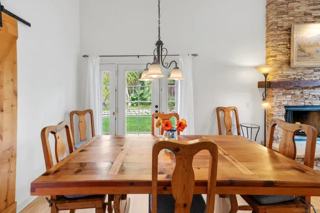 a kitchen with stainless steel appliances granite countertop a refrigerator a stove and a sink