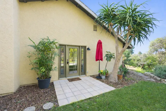 a kitchen with stainless steel appliances granite countertop a refrigerator a stove top oven a sink and dishwasher