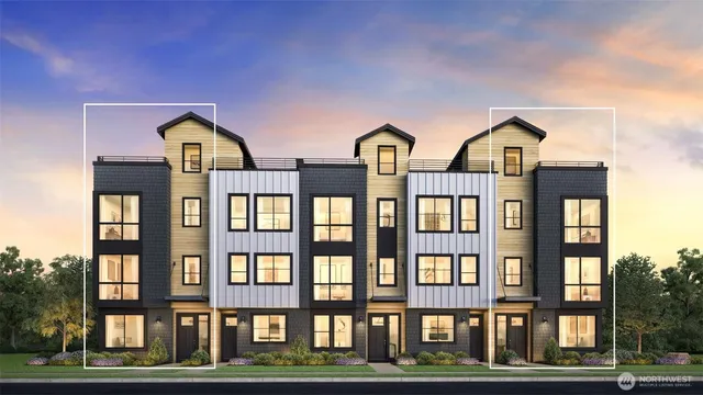 a front view of a residential apartment building with a yard