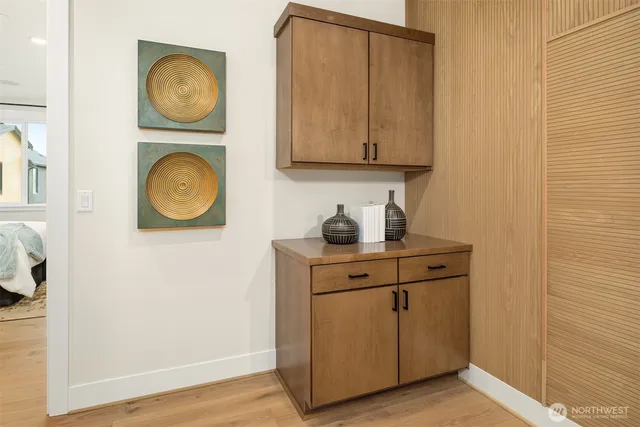 a kitchen with stainless steel appliances granite countertop a sink and a stove with wooden floor