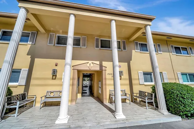 a front view of a building with many windows