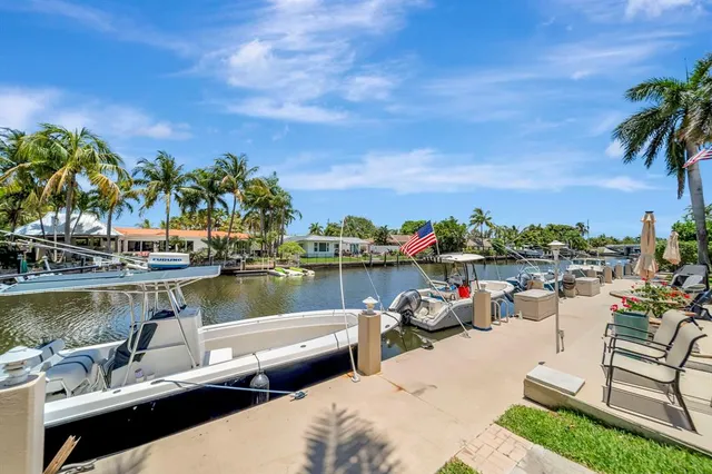 a view of a lake with lawn chairs