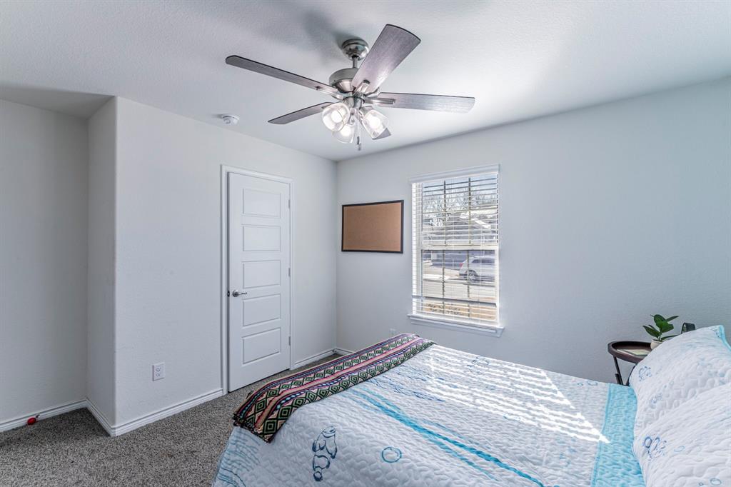 4017 Glastonbury Road McKinney, TX 75071 - Photo 13 of 26 a bedroom with a large bed and a window