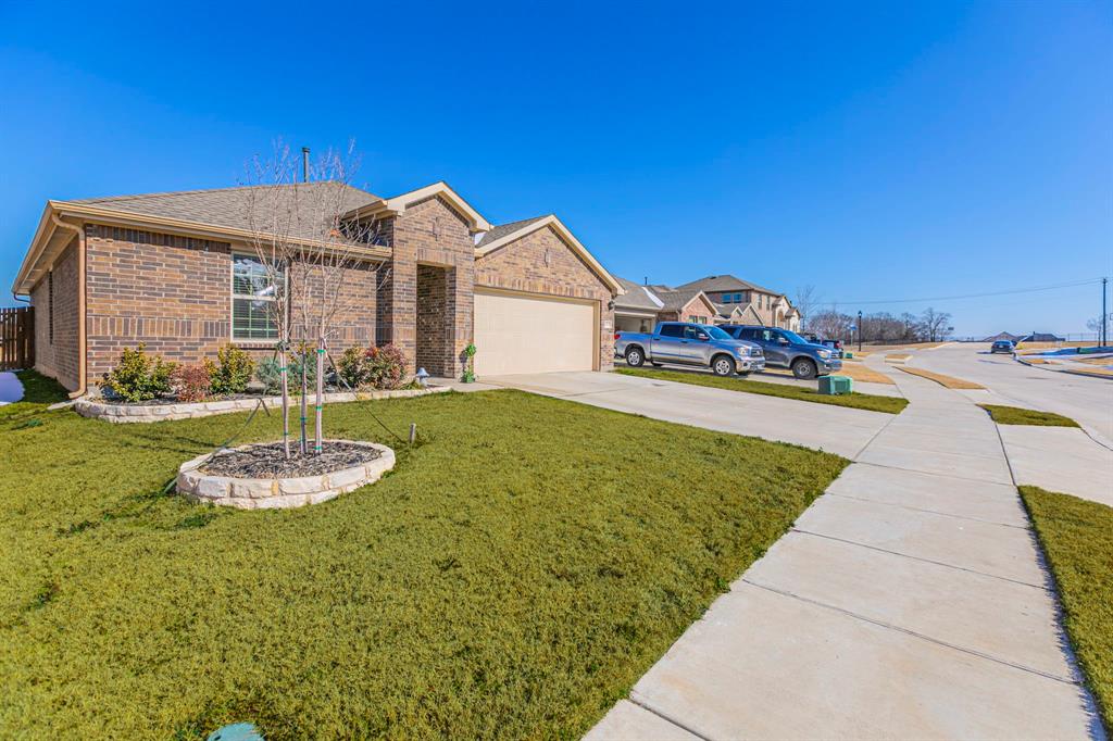 4017 Glastonbury Road McKinney, TX 75071 - Photo 21 of 26 a front view of a house with a yard