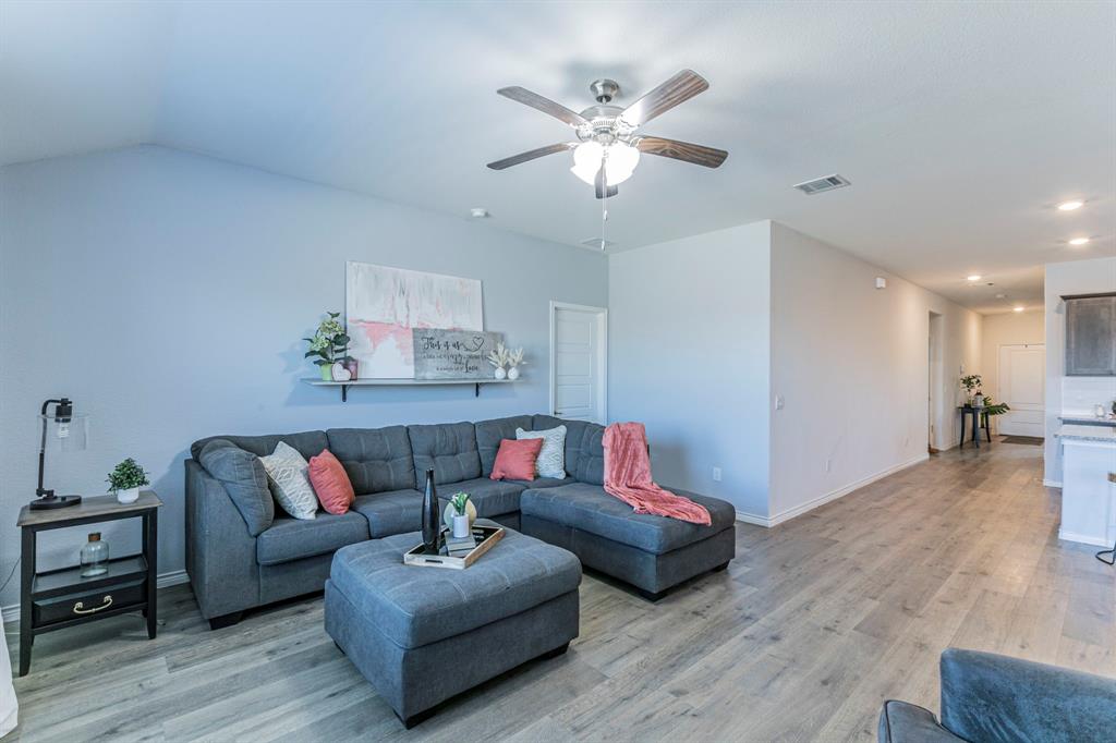 4017 Glastonbury Road McKinney, TX 75071 - Photo 5 of 26 a living room with furniture and wooden floor