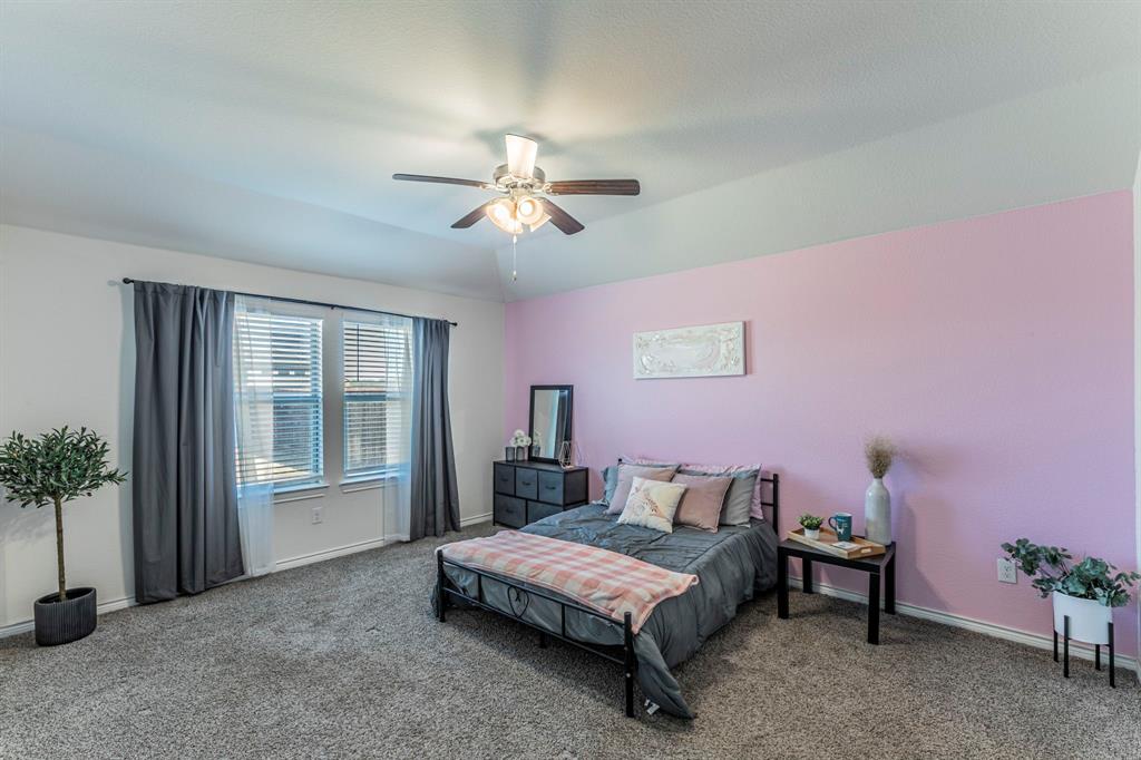 4017 Glastonbury Road McKinney, TX 75071 - Photo 8 of 26 a bedroom with a bed dresser and a window