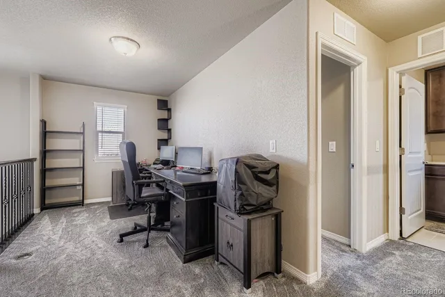a view of a workspace with furniture