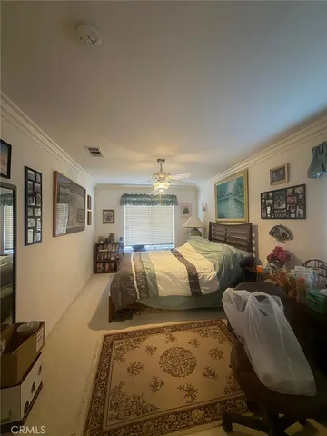 a bedroom with two beds and a couch