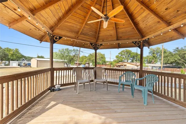a view of a two chairs and table in the balcony