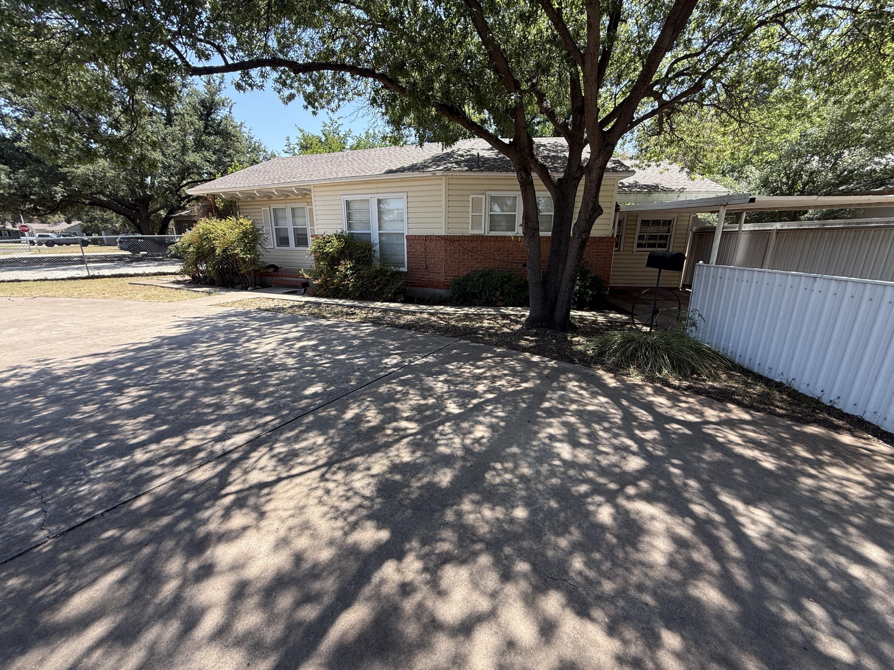 2805 27th Street Lubbock, TX 79410 - Photo 2 of 11 a front view of a house with garden