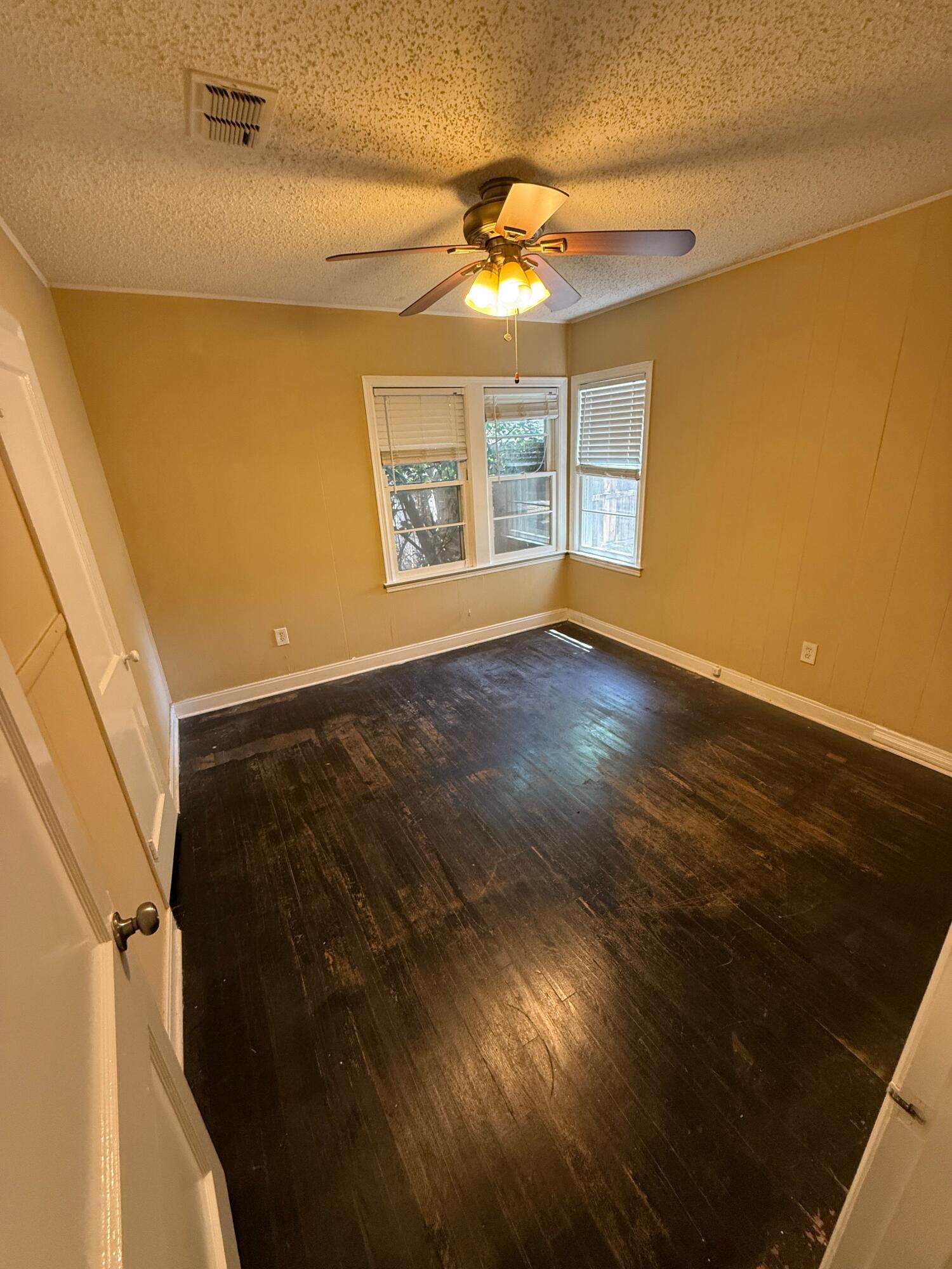 2805 27th Street Lubbock, TX 79410 - Photo 4 of 11 a view of an empty room with a window