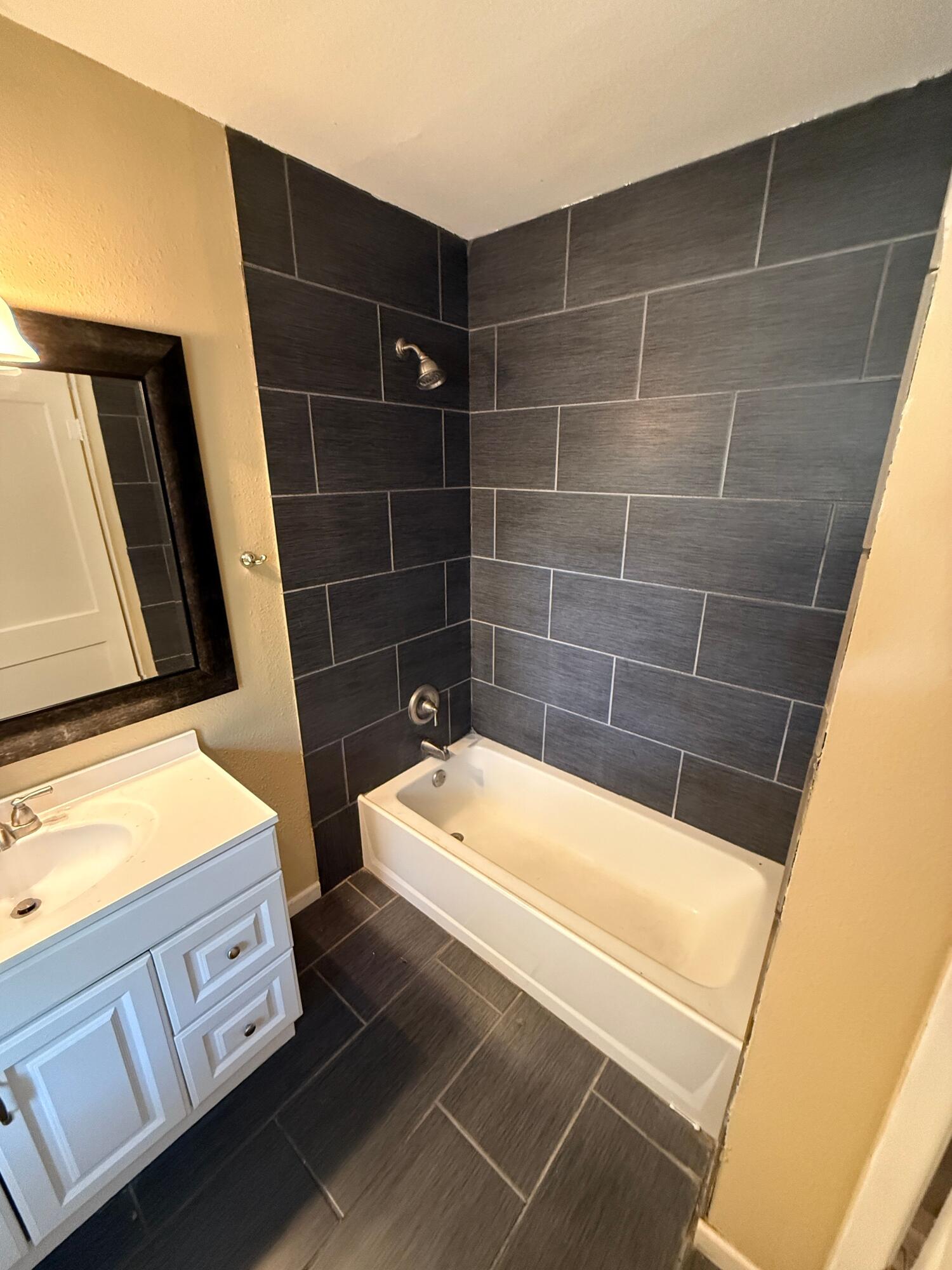 2805 27th Street Lubbock, TX 79410 - Photo 6 of 11 a bathroom with a bathtub