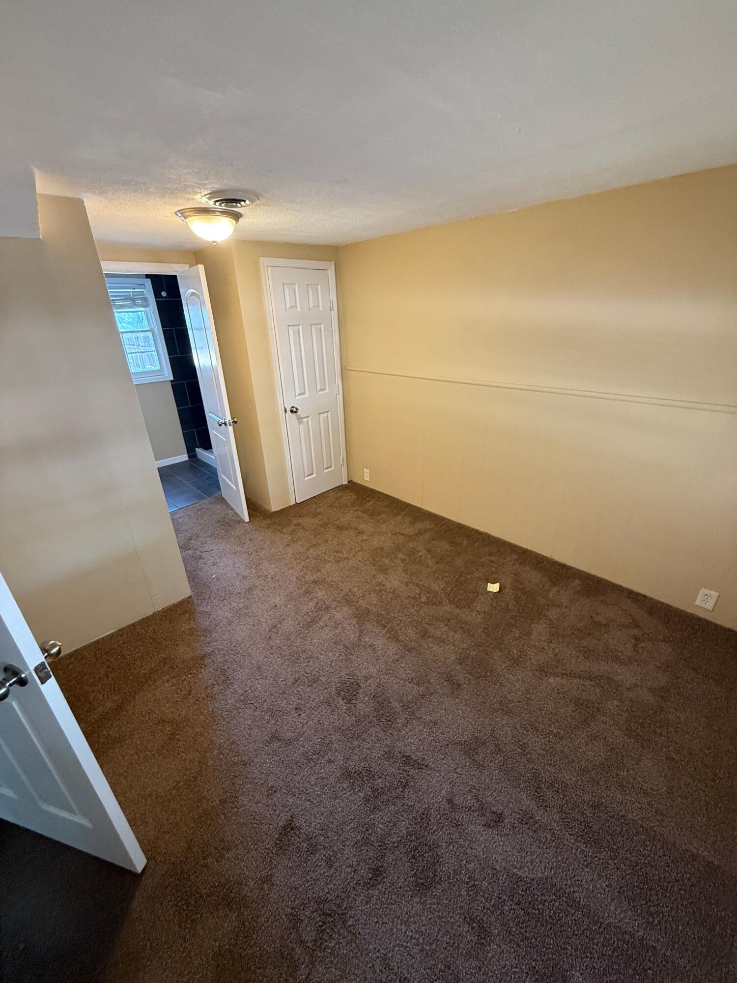 2805 27th Street Lubbock, TX 79410 - Photo 8 of 11 an empty room with stairs