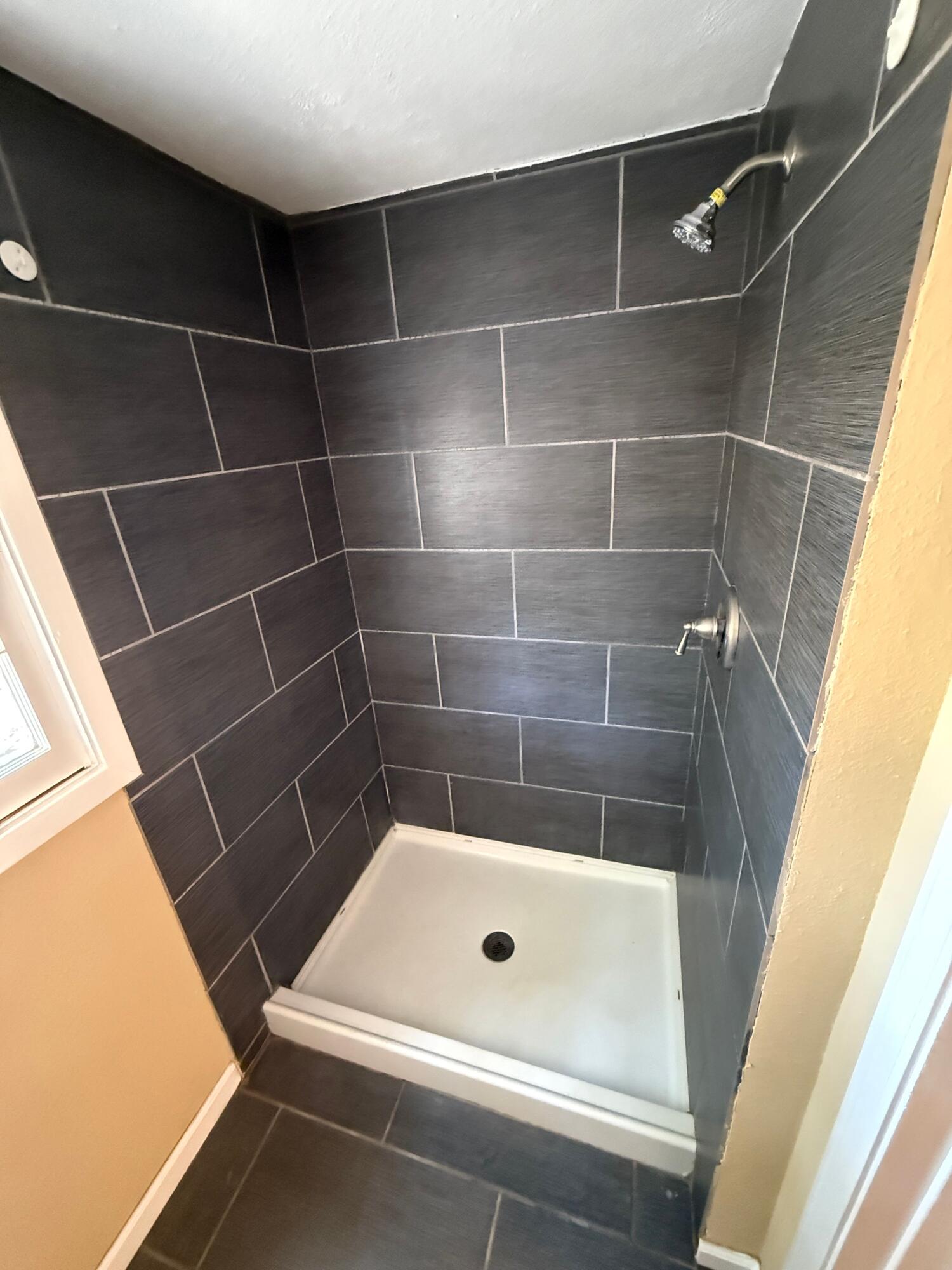 2805 27th Street Lubbock, TX 79410 - Photo 9 of 11 a bathroom with a bathtub