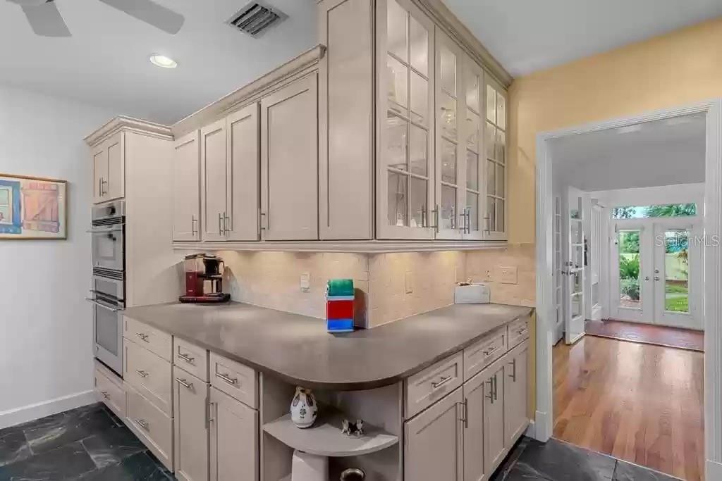 220 Lyndhurst Street Dunedin, FL 34698 - Photo 18 of 20 a kitchen with stainless steel appliances granite countertop a sink and cabinets
