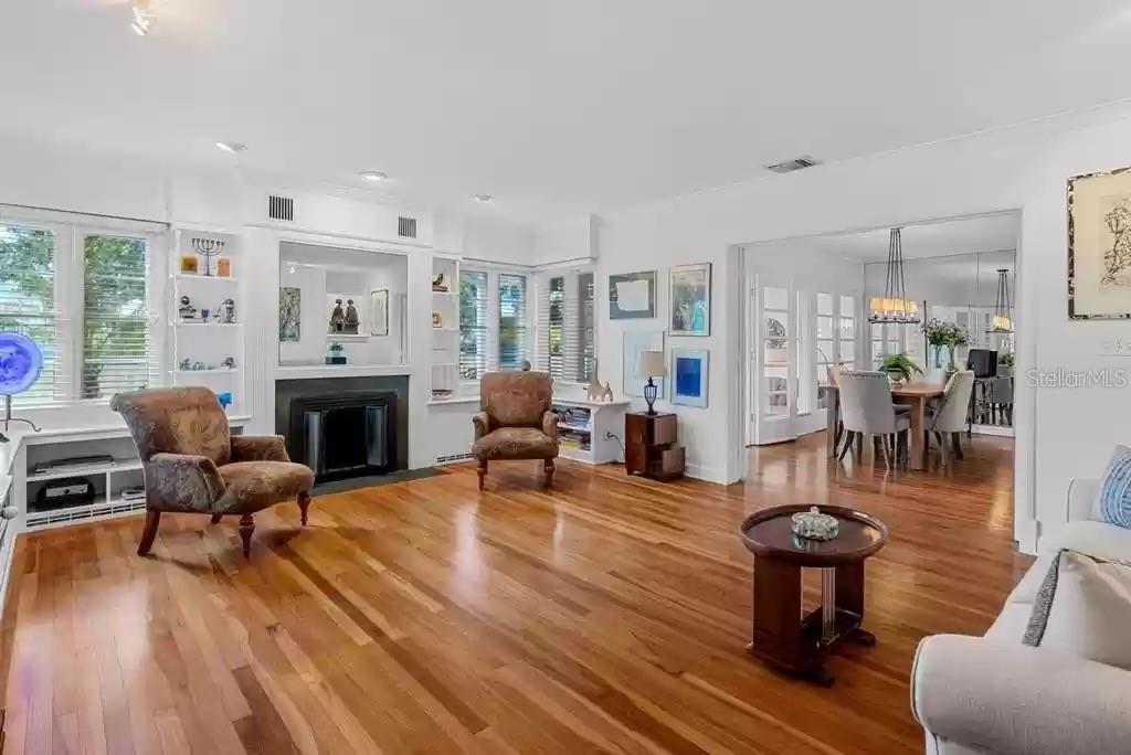 220 Lyndhurst Street Dunedin, FL 34698 - Photo 19 of 20 a living room with furniture a fireplace and a table
