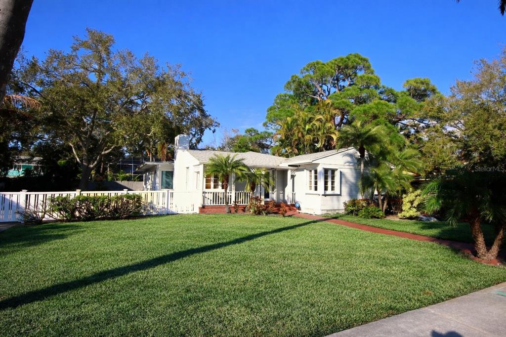 220 Lyndhurst Street Dunedin, FL 34698 - Photo 3 of 20 a front view of a house with a garden