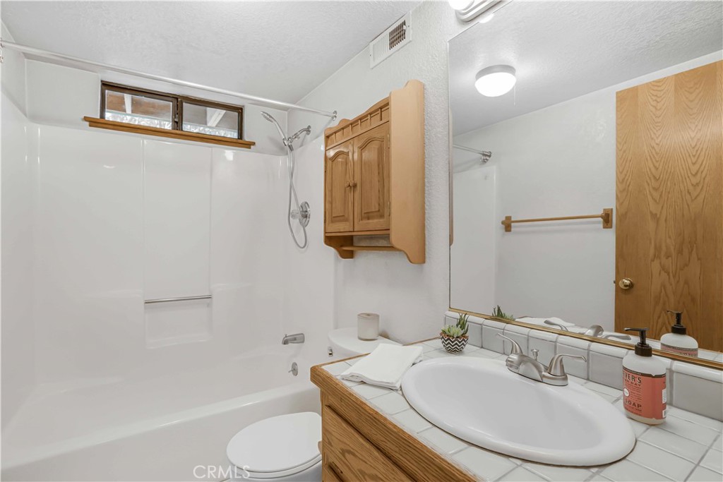 2755 Taft Place Cambria, CA 93428 - Photo 21 of 43 a bathroom with a sink and a mirror